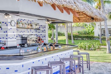 a bar with a stool and a bar counter