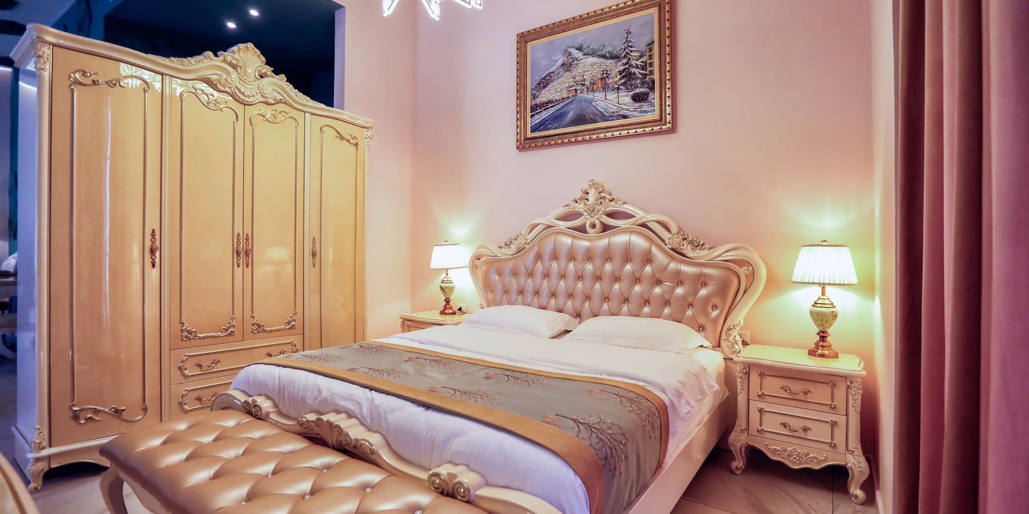 a bedroom with a bed and a mirror