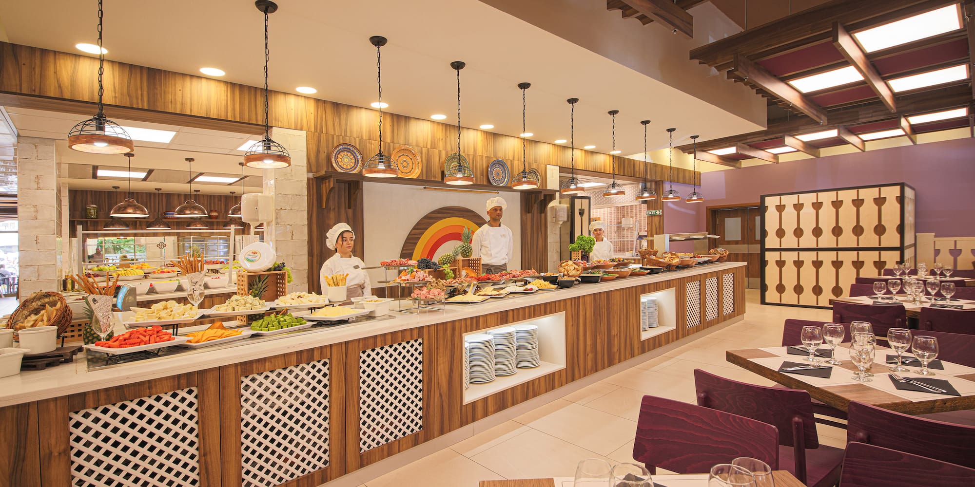 a restaurant with people in the kitchen