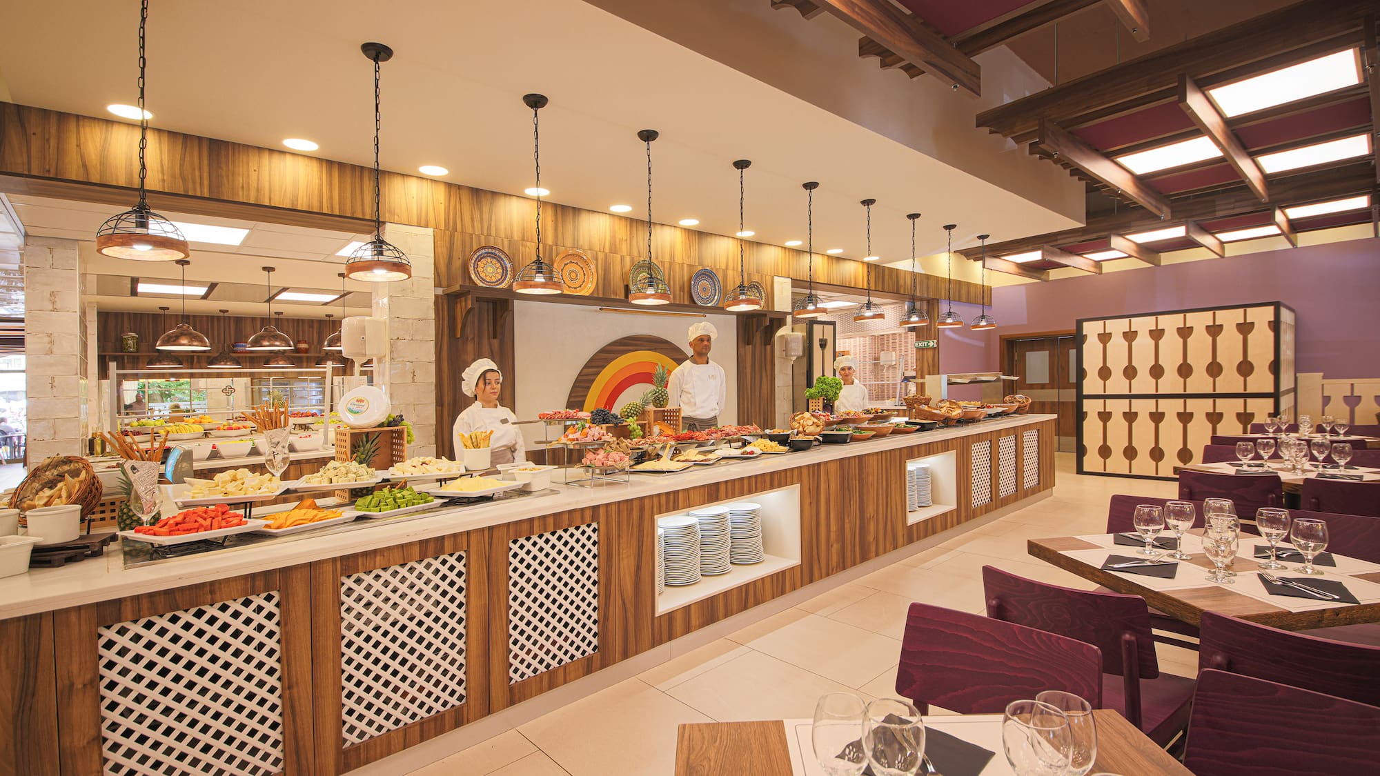 a restaurant with people in the kitchen