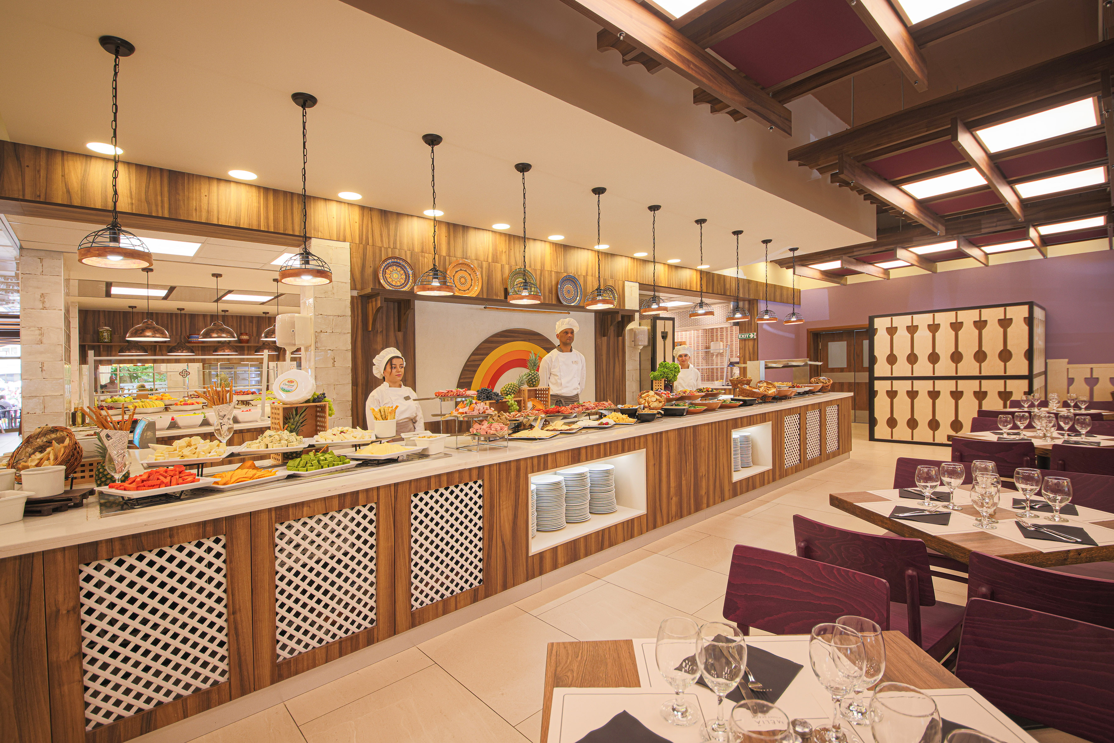 a restaurant with people in the kitchen