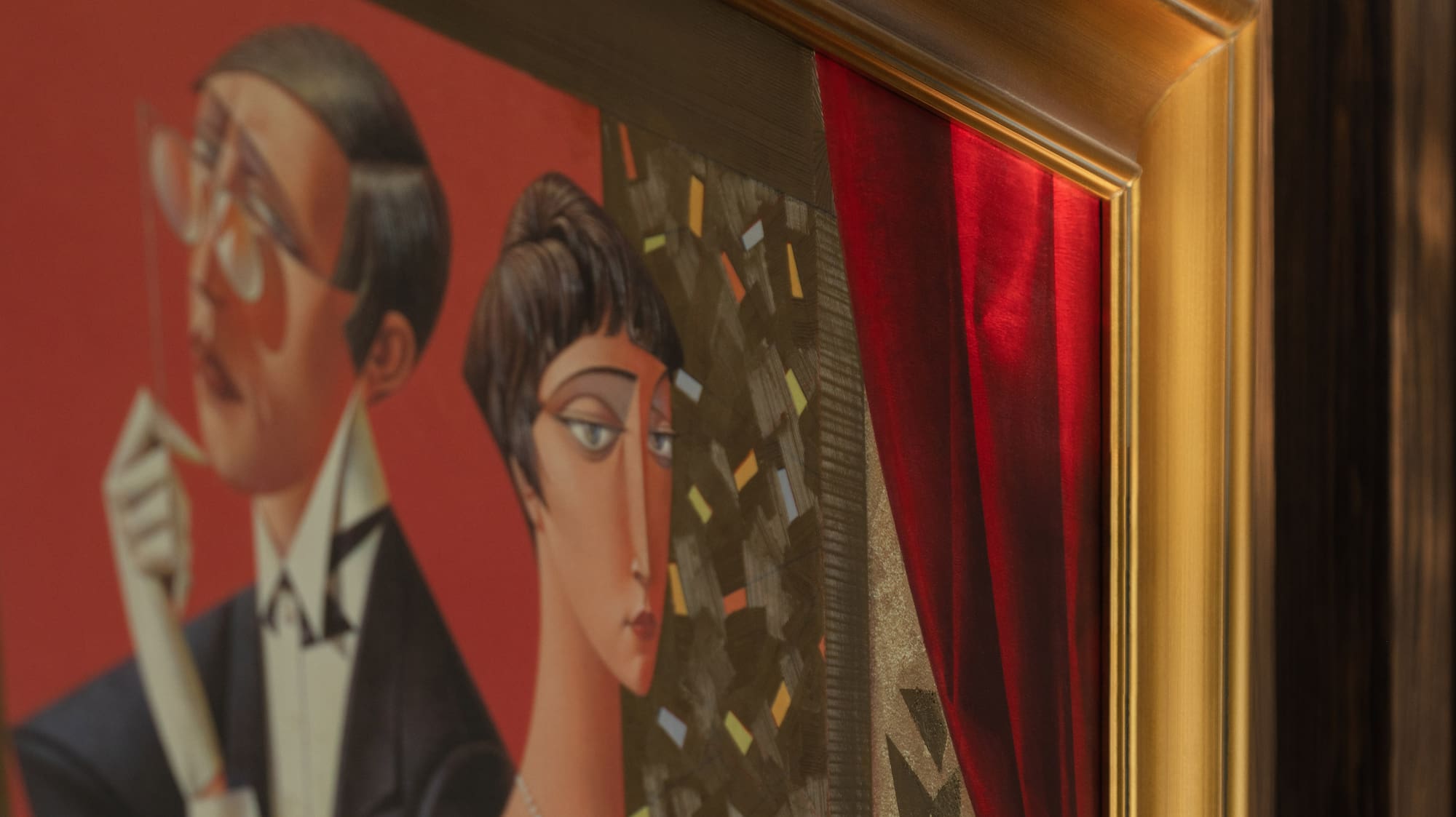 a painting of a man and woman in a gold frame