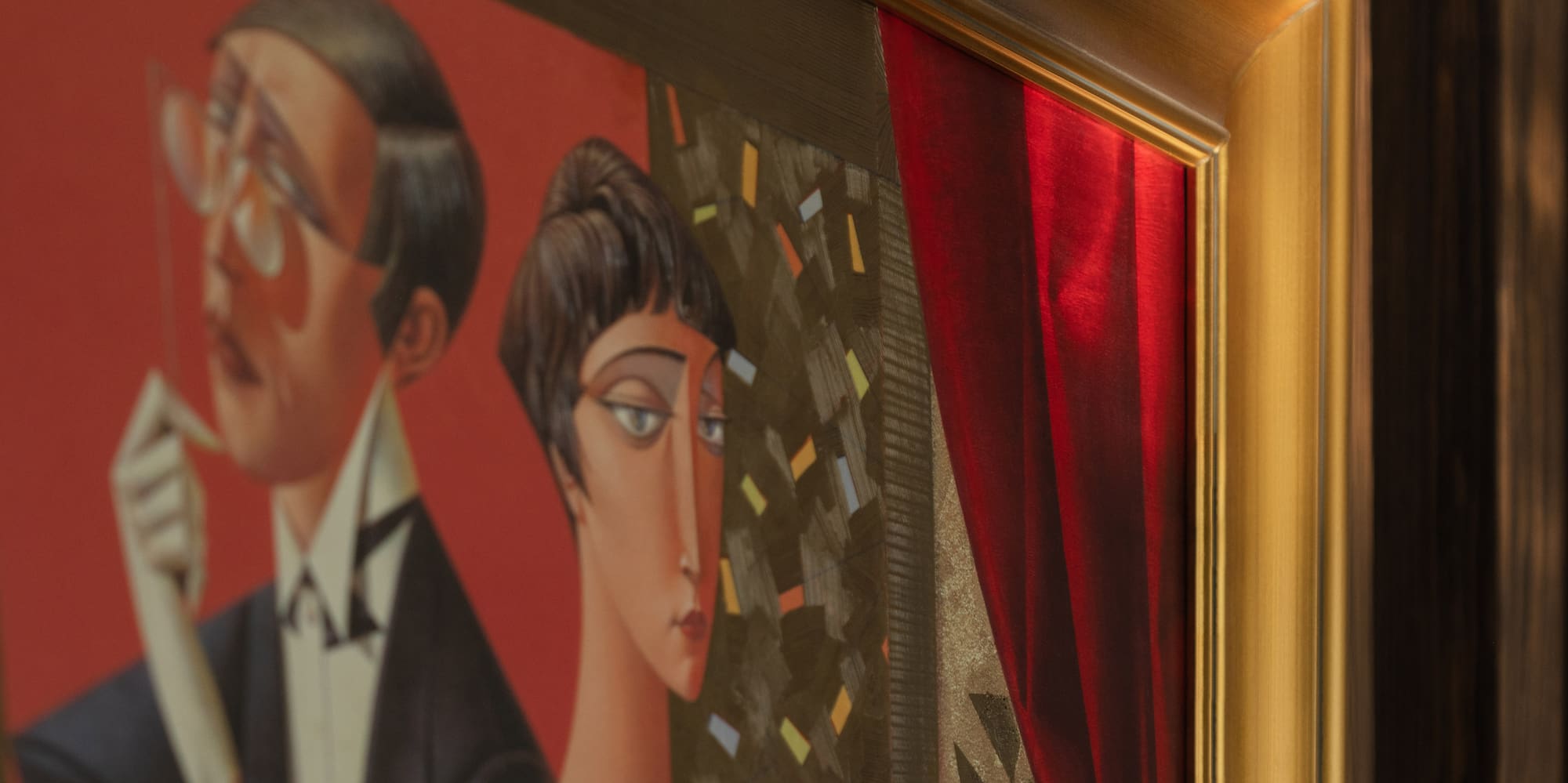 a painting of a man and woman in a gold frame