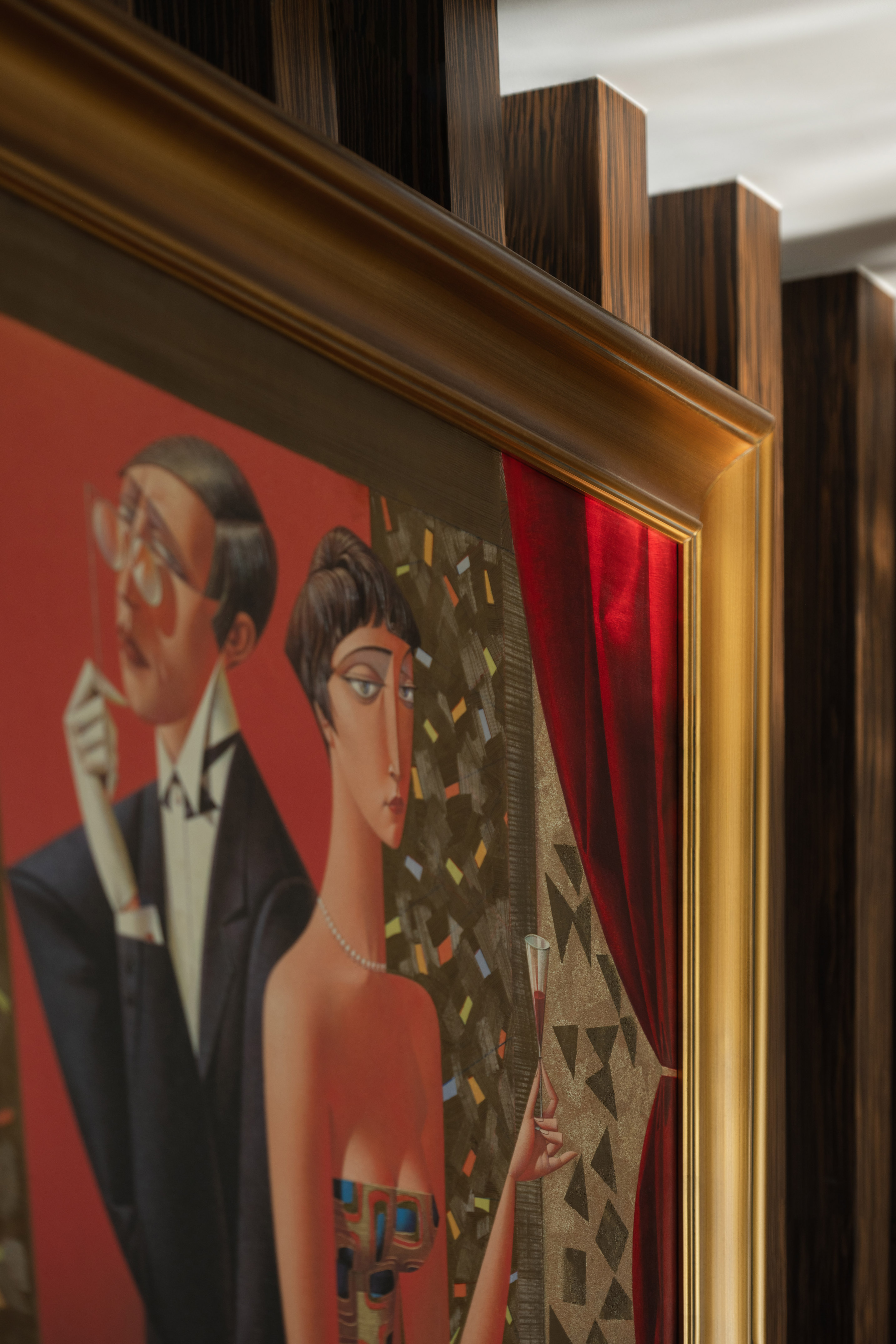 Cubist painting: elegant man in tuxedo, woman with drink, pearl necklace, gold frame.