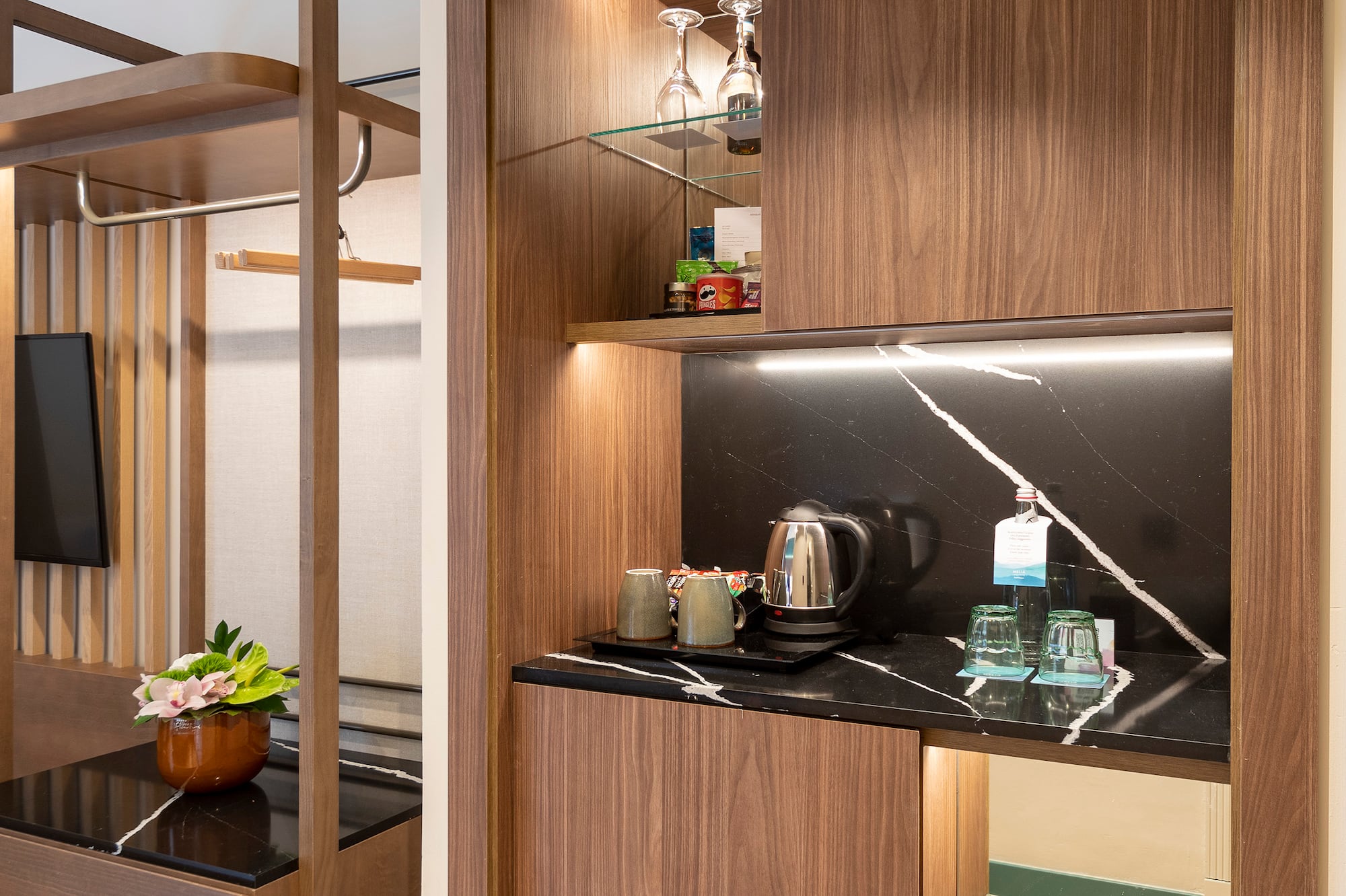 a room with a coffee bar and a table