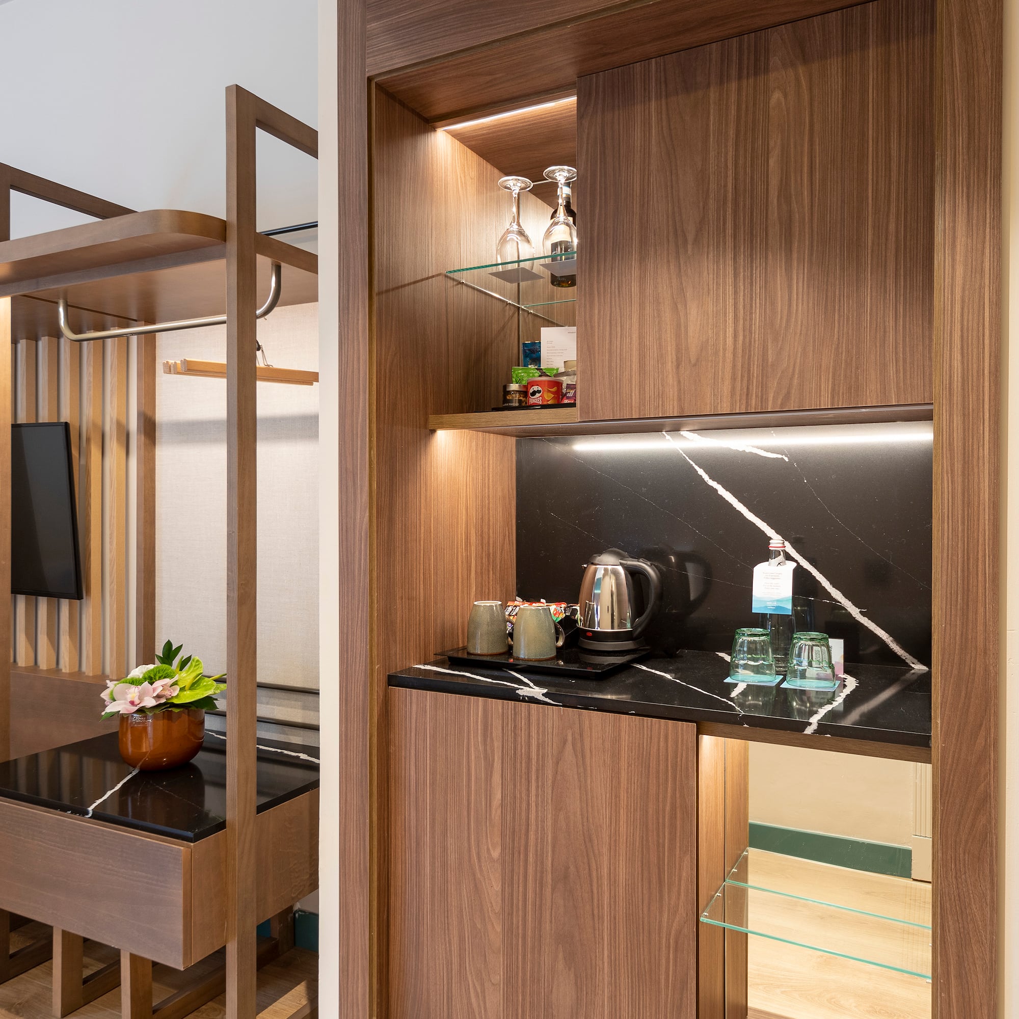 a room with a coffee bar and a table