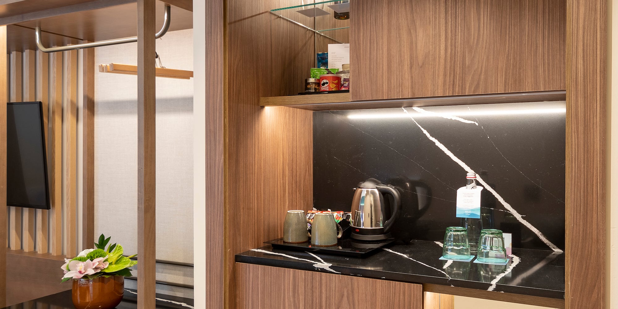 a room with a coffee bar and a table