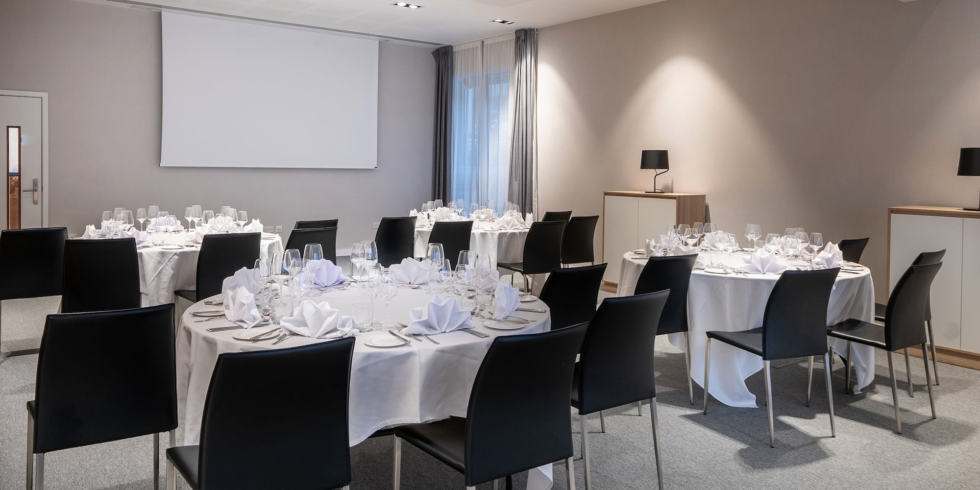 a room with tables and chairs