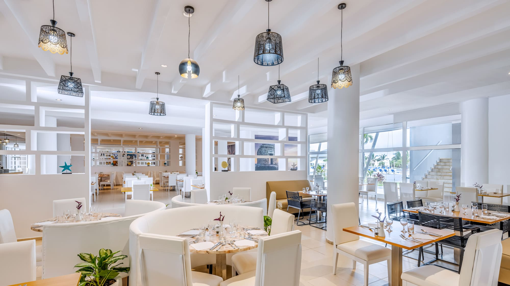 a restaurant with tables and chairs