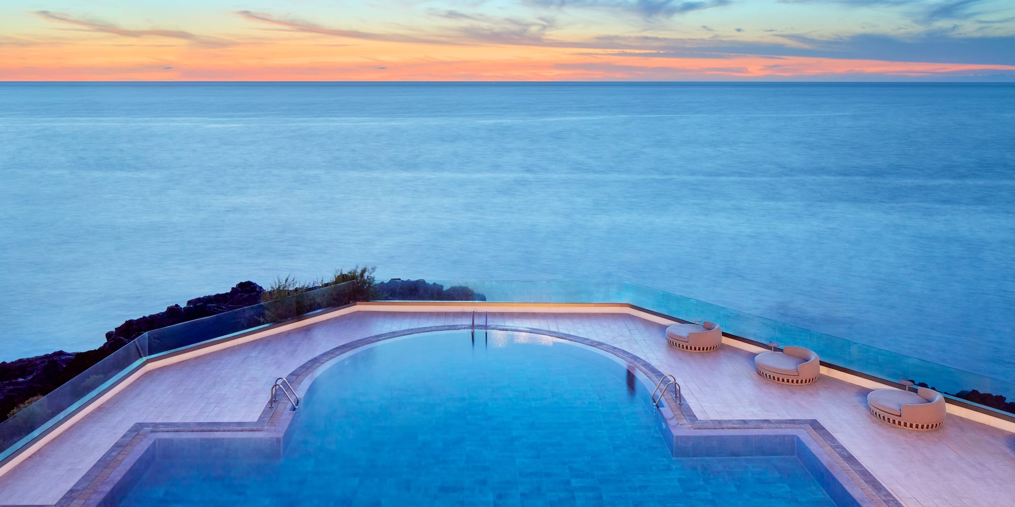a pool overlooking the ocean