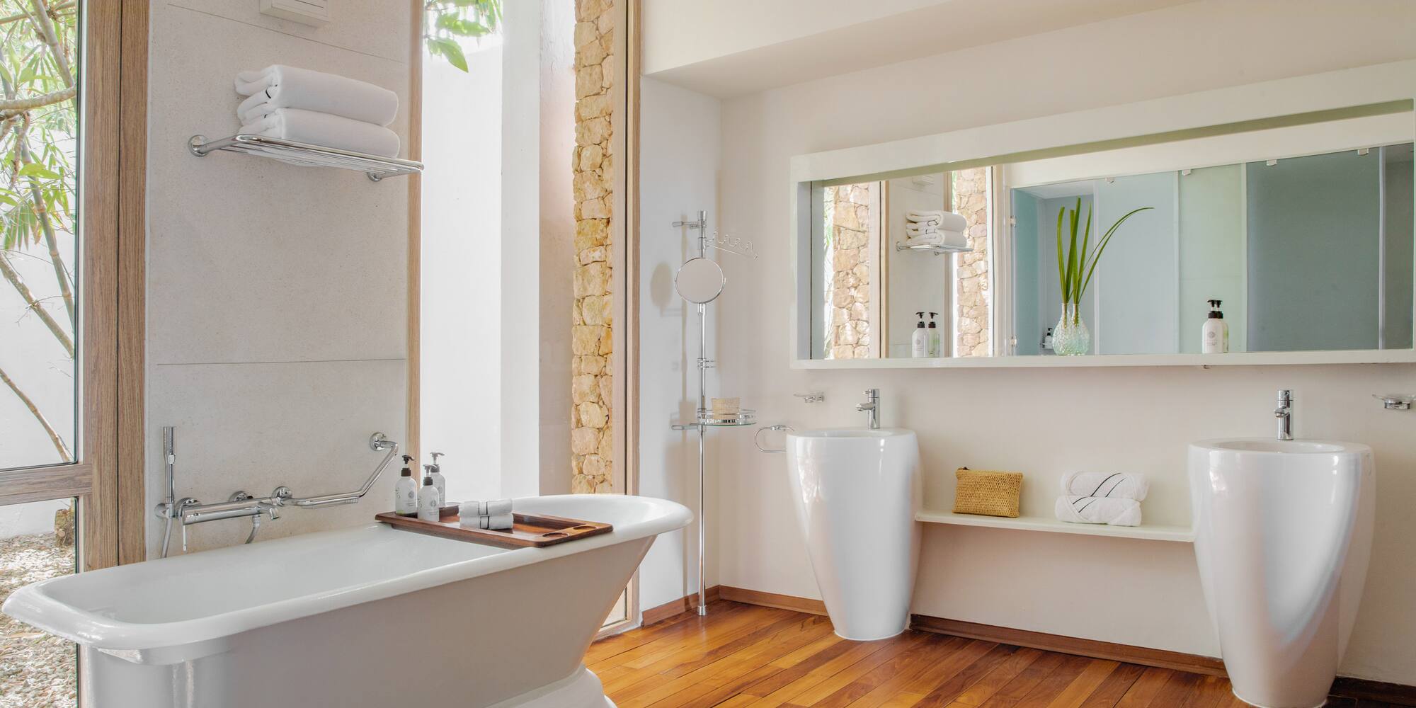 a bathroom with a bathtub and a mirror