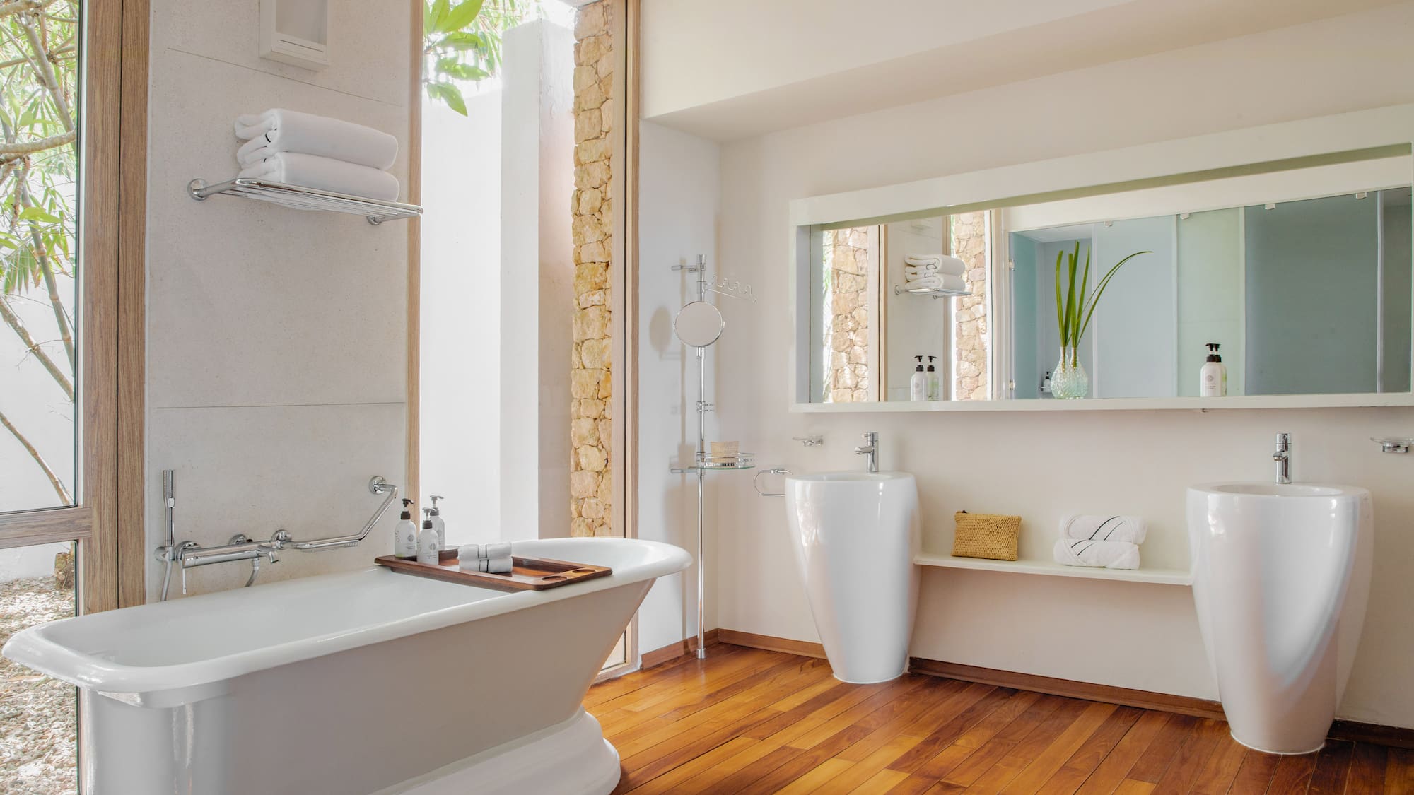 a bathroom with a bathtub and a mirror