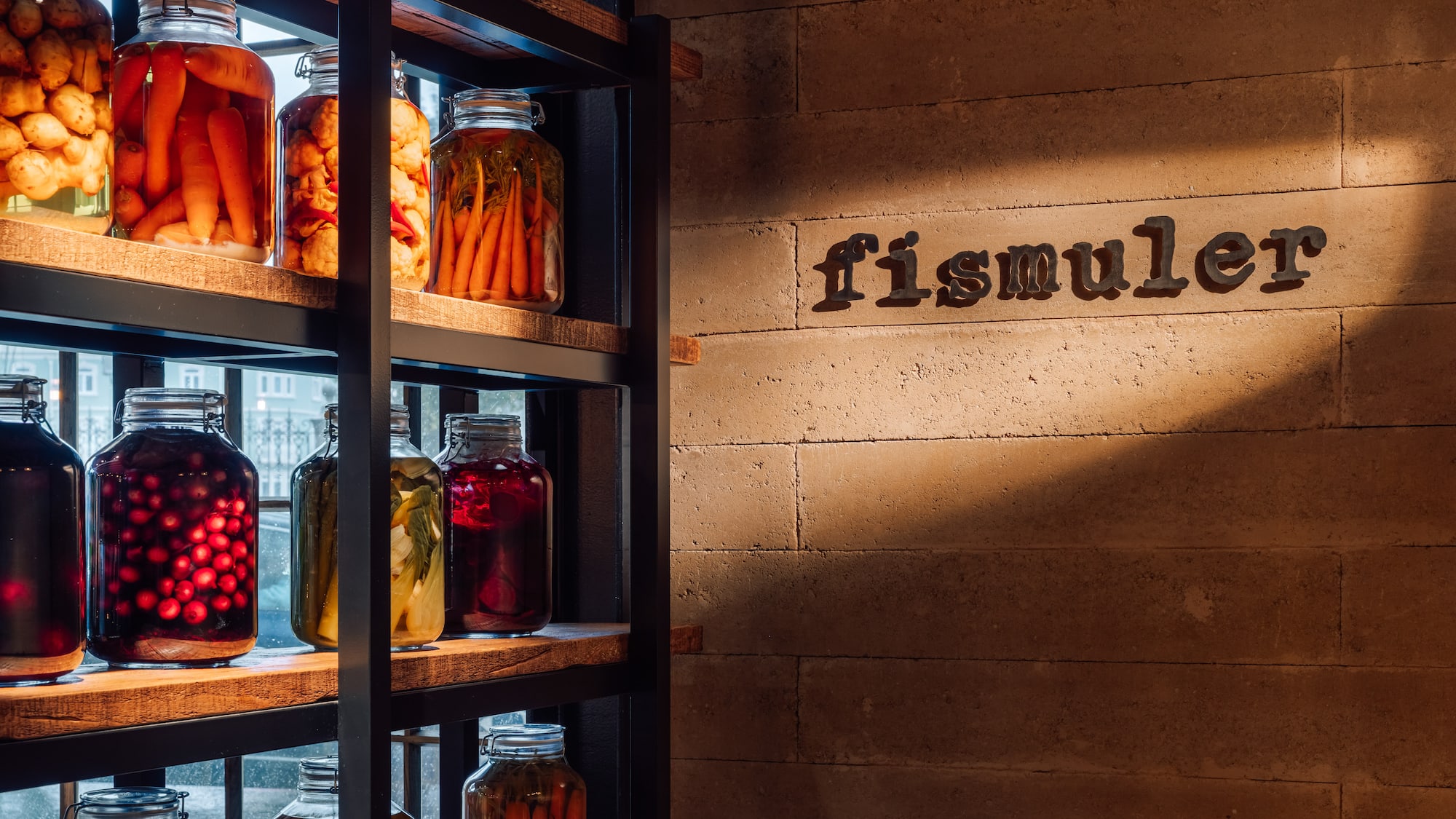 a shelf with jars of food