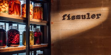 a shelf with jars of food