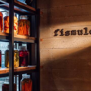 a shelf with jars of food