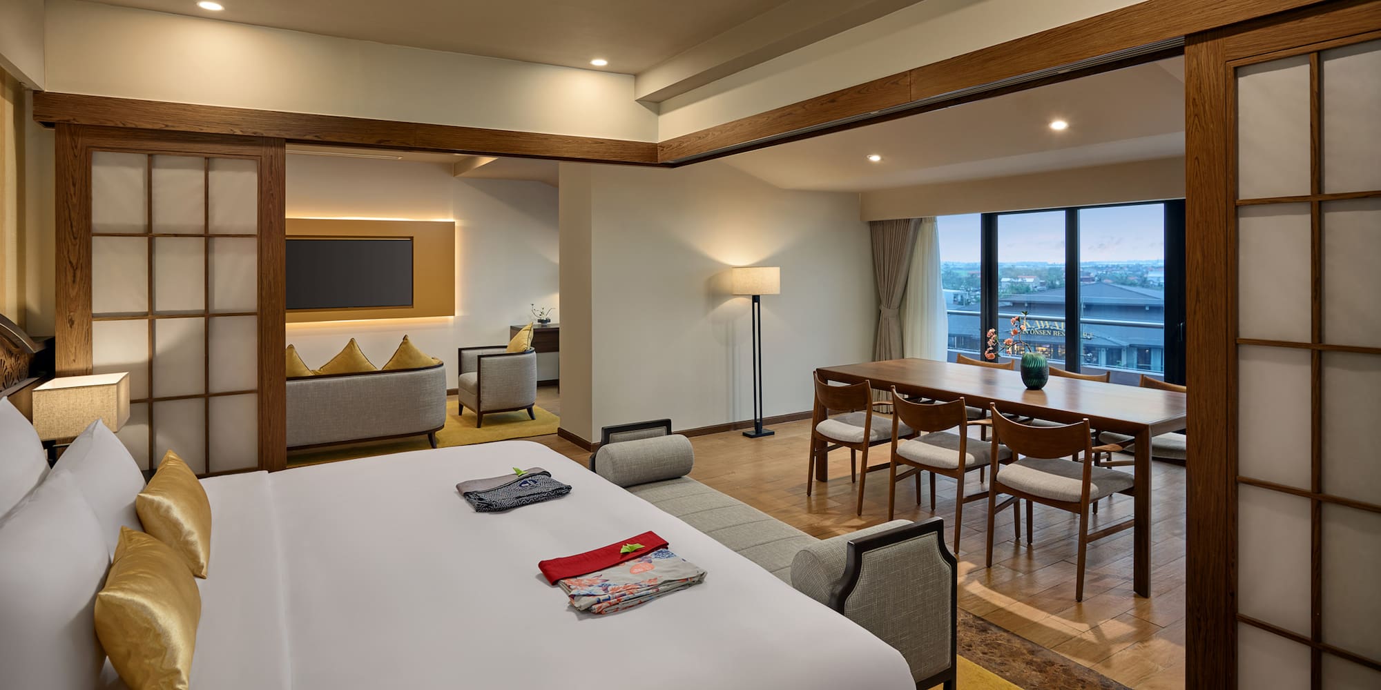 a room with a large bed and a table