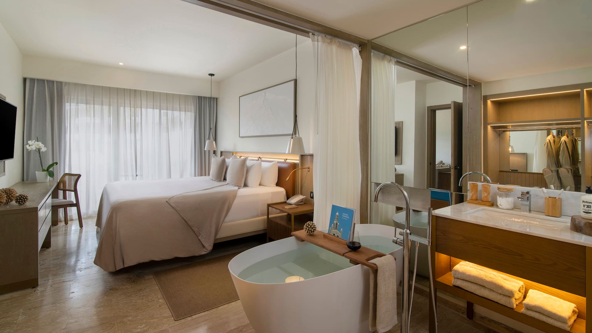 a room with a bed and a bathtub