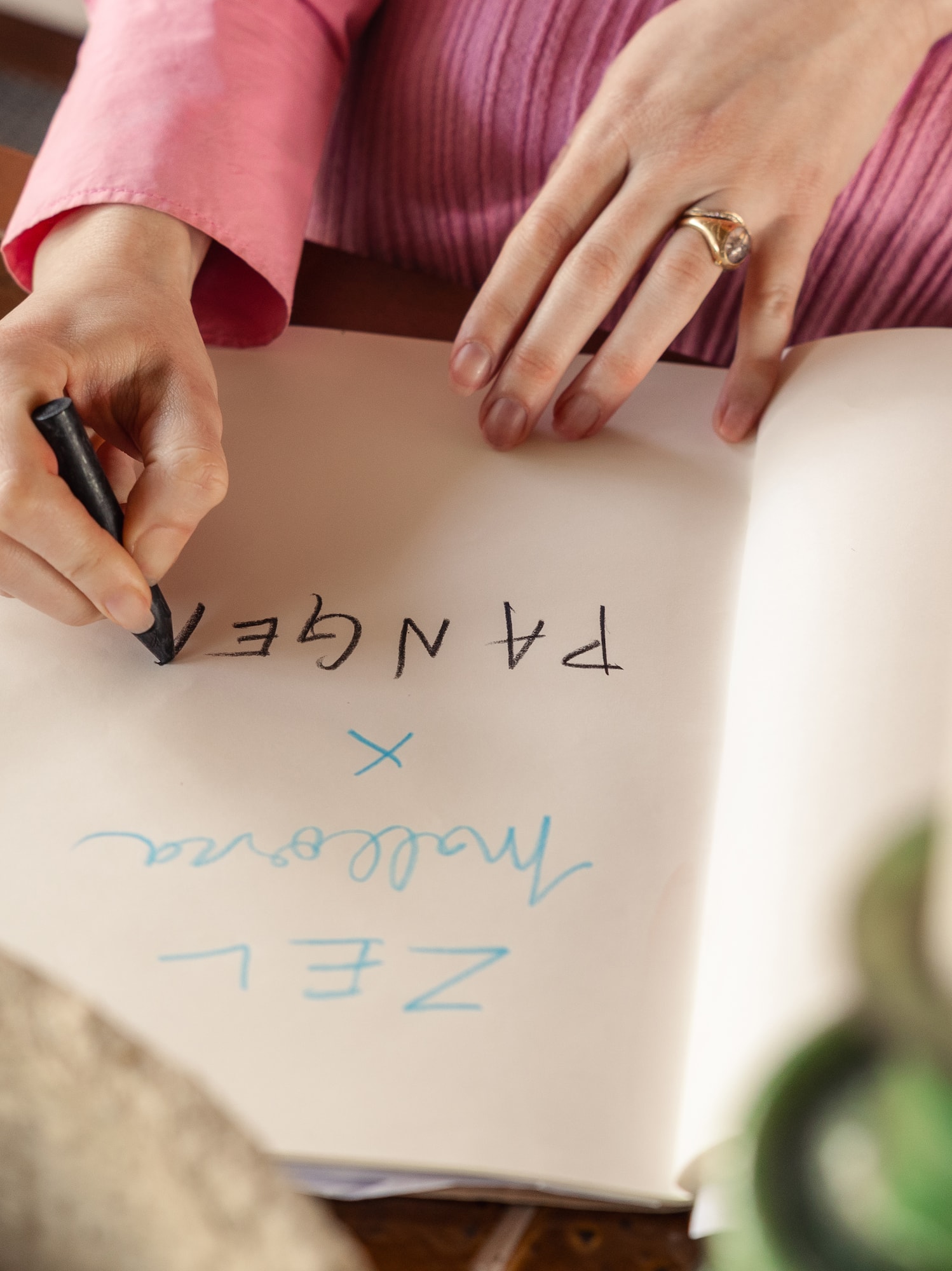 a person writing in a book