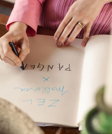 a person writing in a book