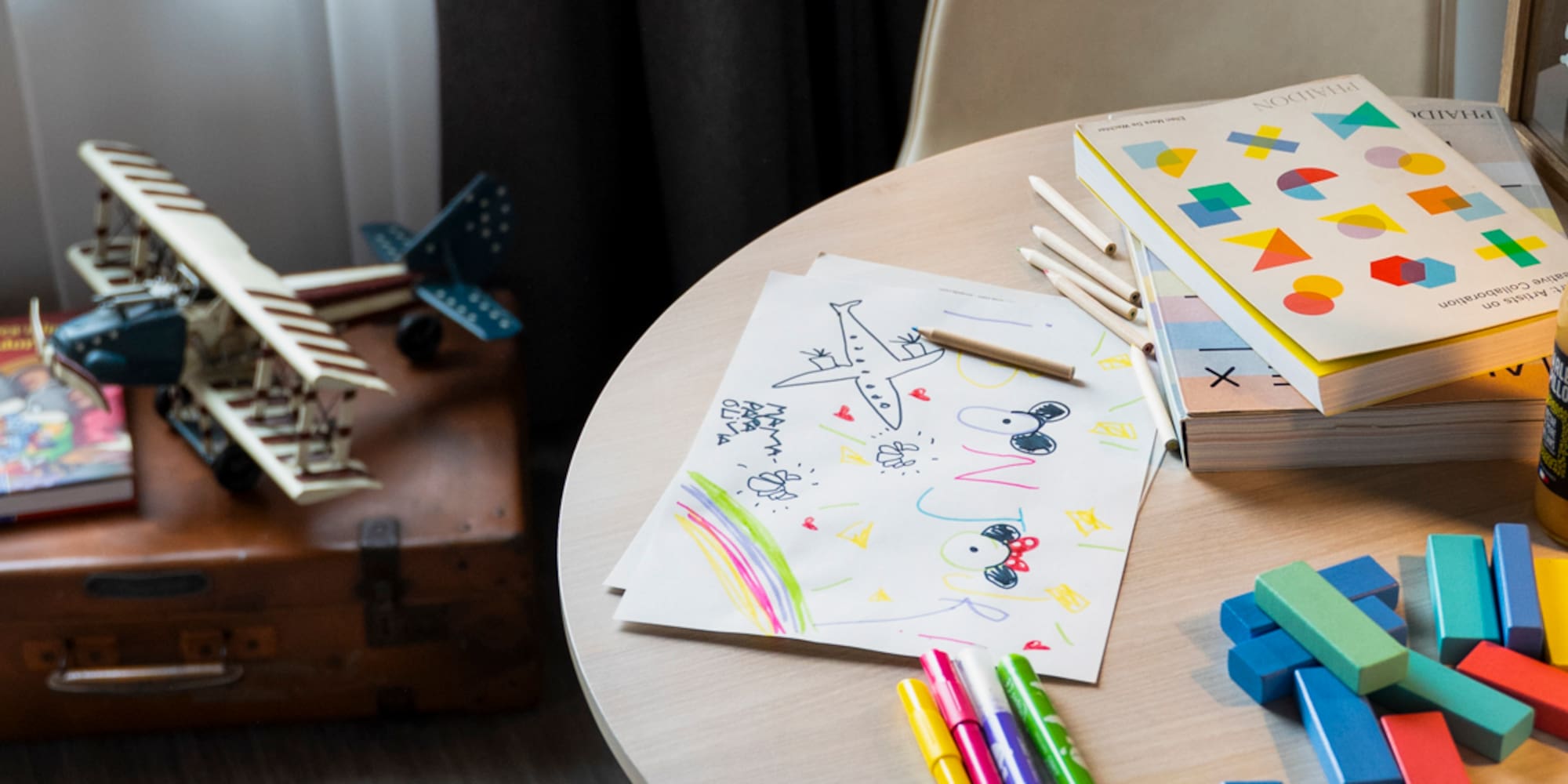 a table with toys and books on it