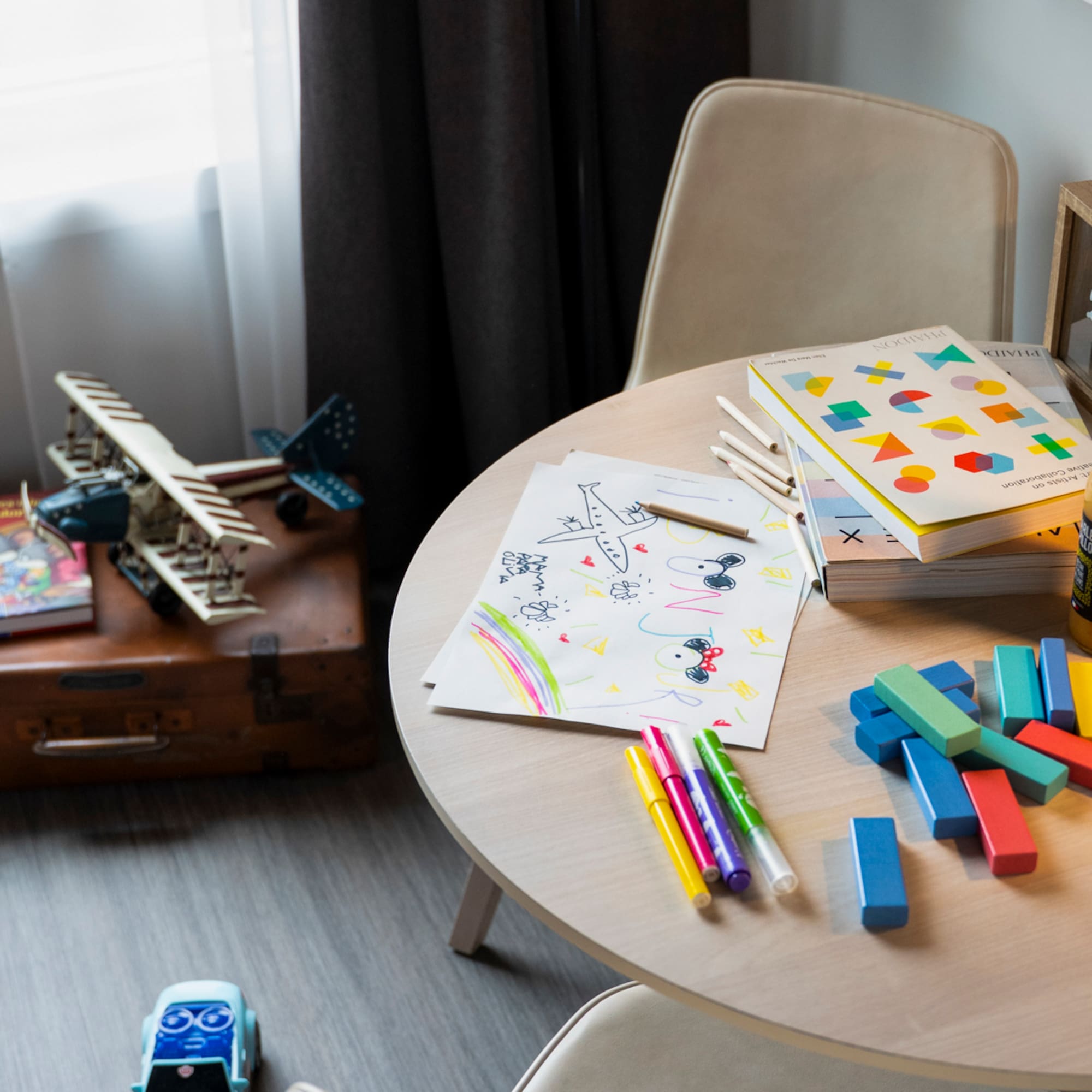 a table with toys and books on it