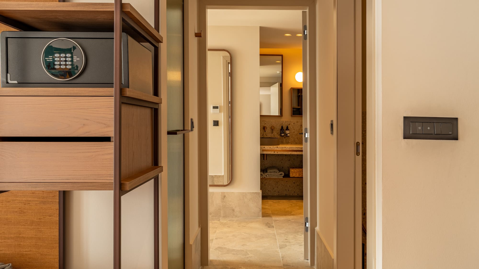 a hallway with a safe and a shelf