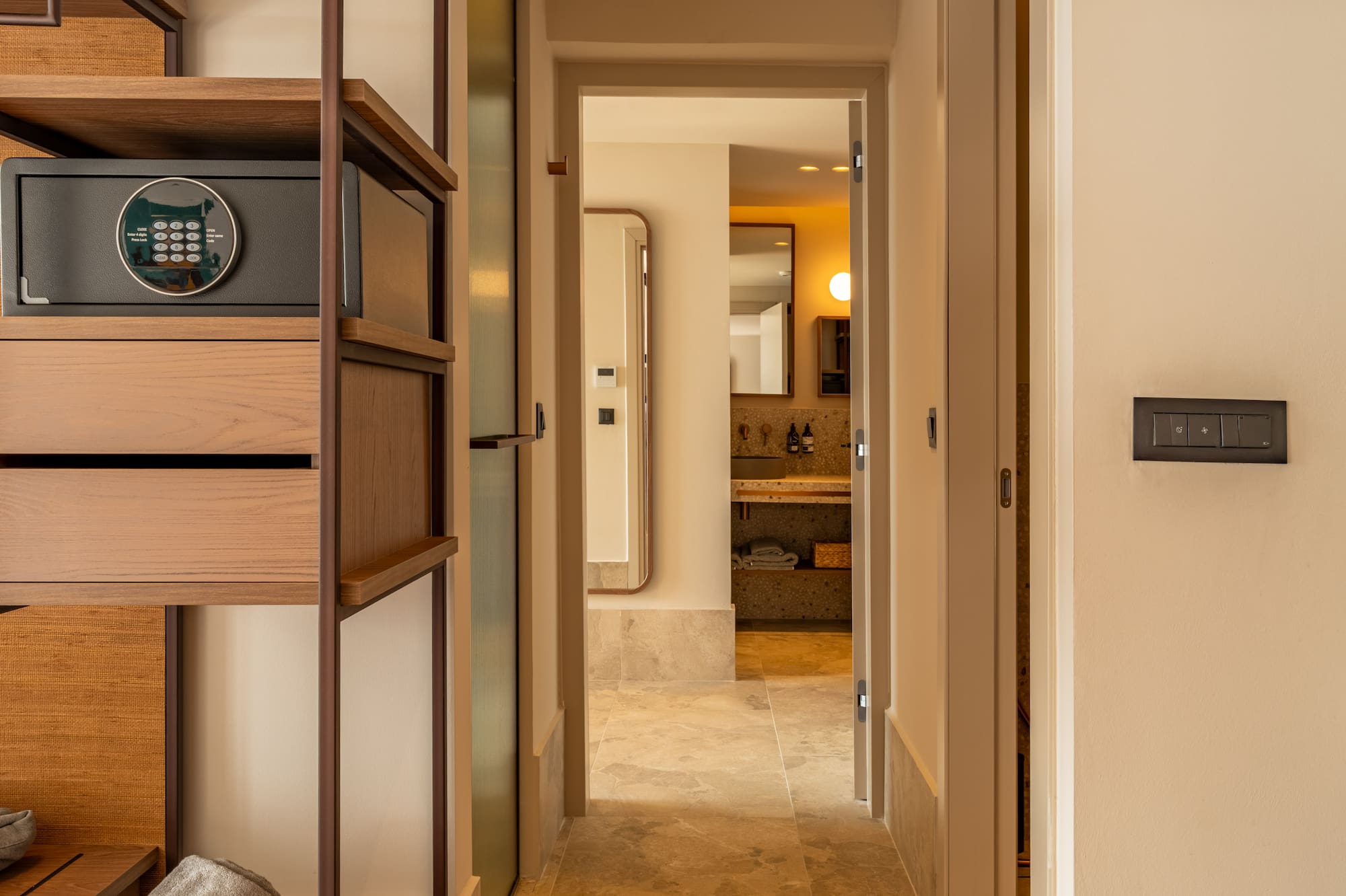 a hallway with a safe and a shelf