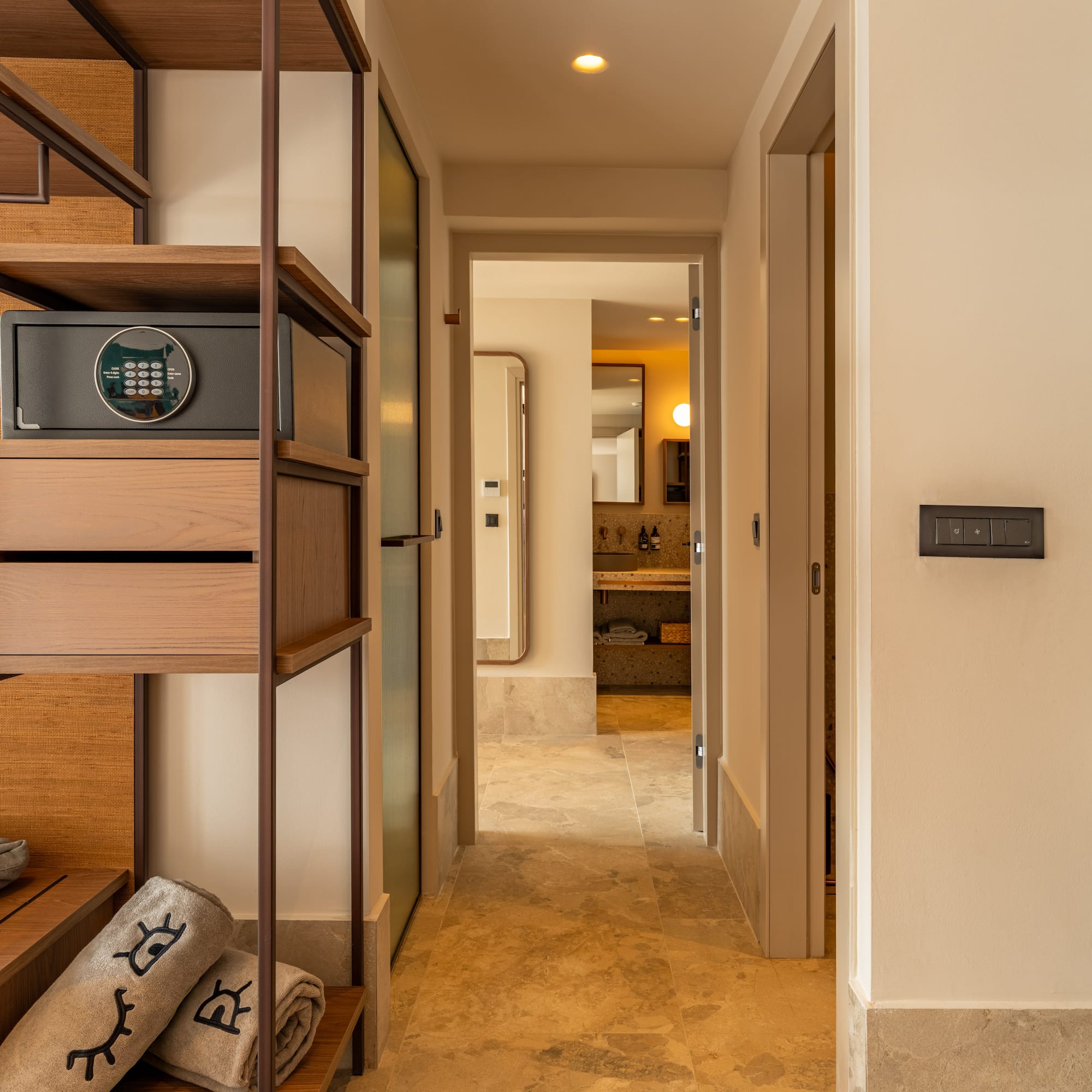 a hallway with a safe and a shelf