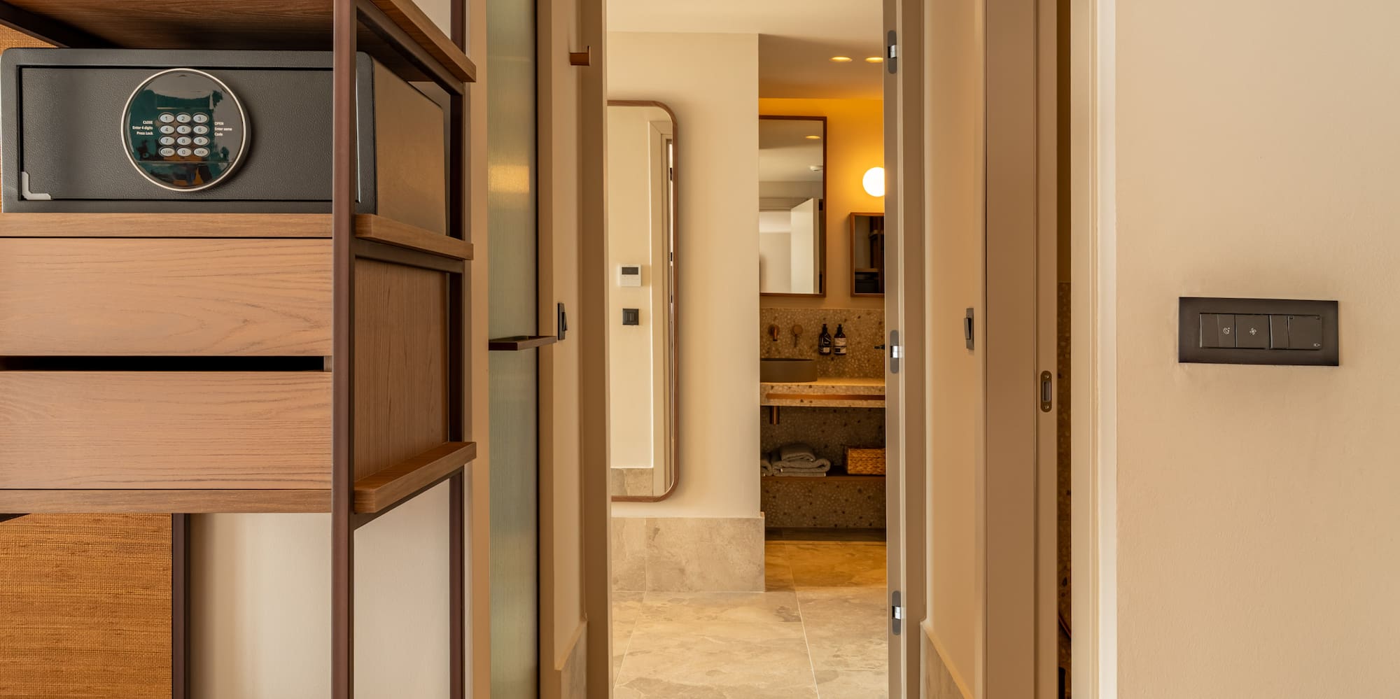 a hallway with a safe and a shelf