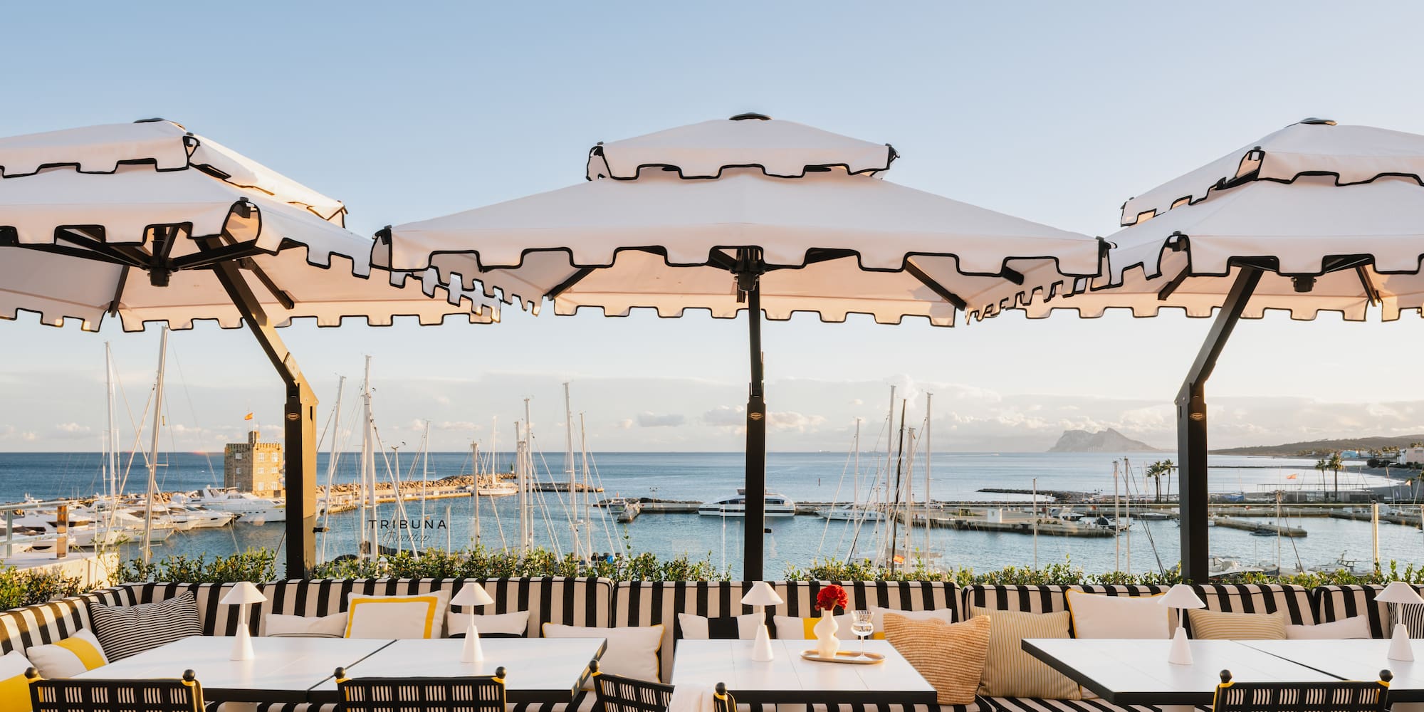 a restaurant with umbrellas and tables