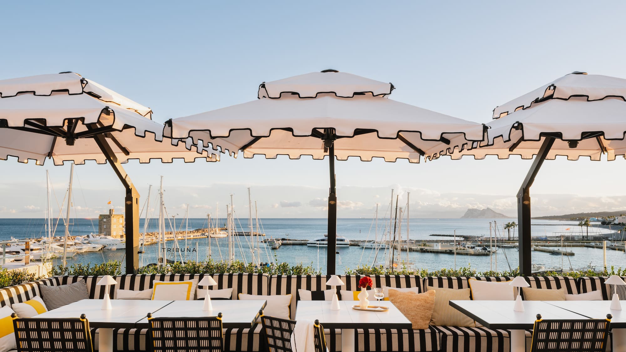a restaurant with umbrellas and tables