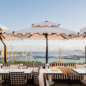 a restaurant with umbrellas and tables