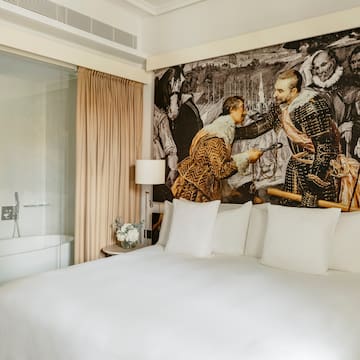 a bed with a picture of men on it