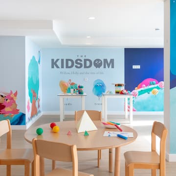 a room with a table and chairs