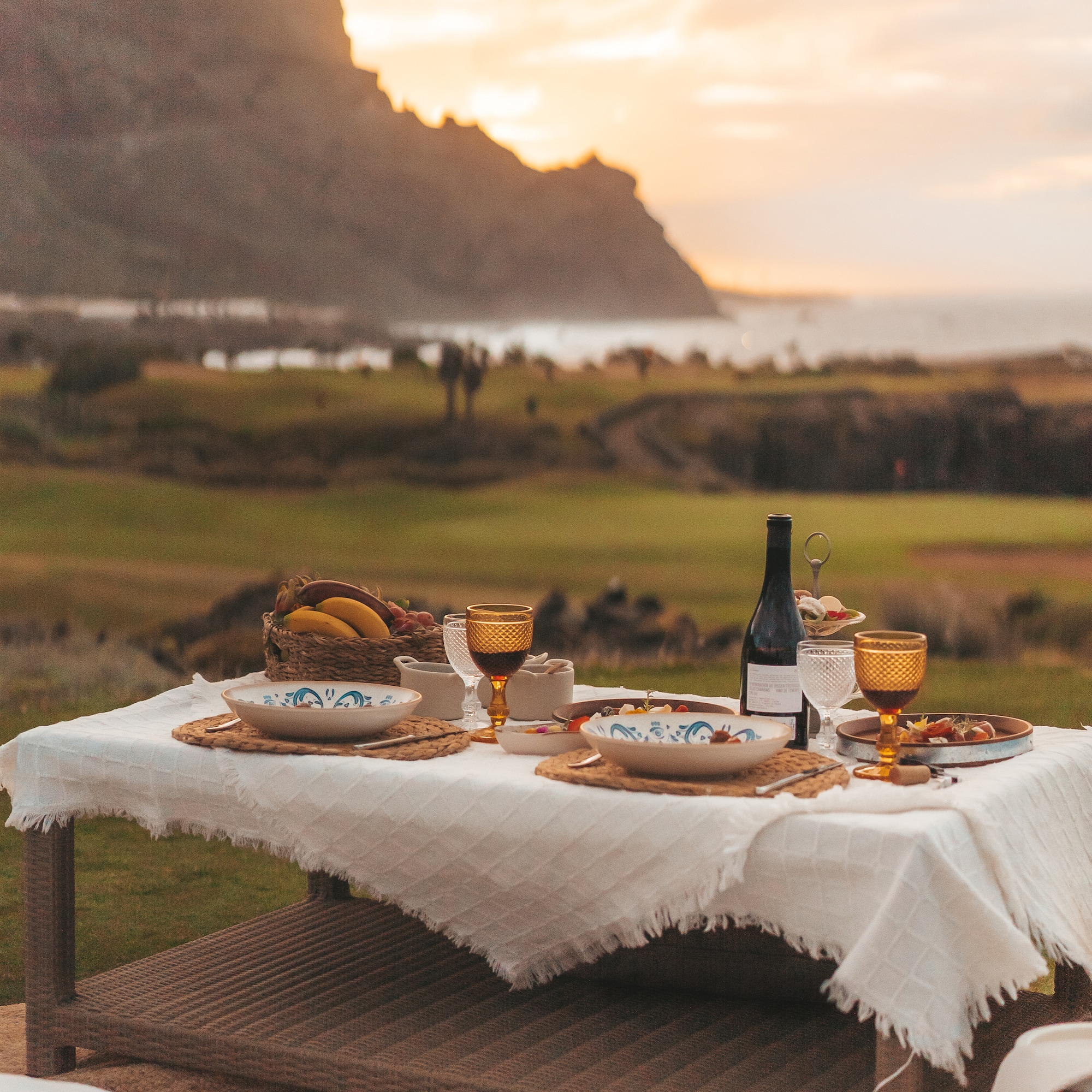 a table with food and wine on it
