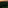 a sunset over a green field with trees