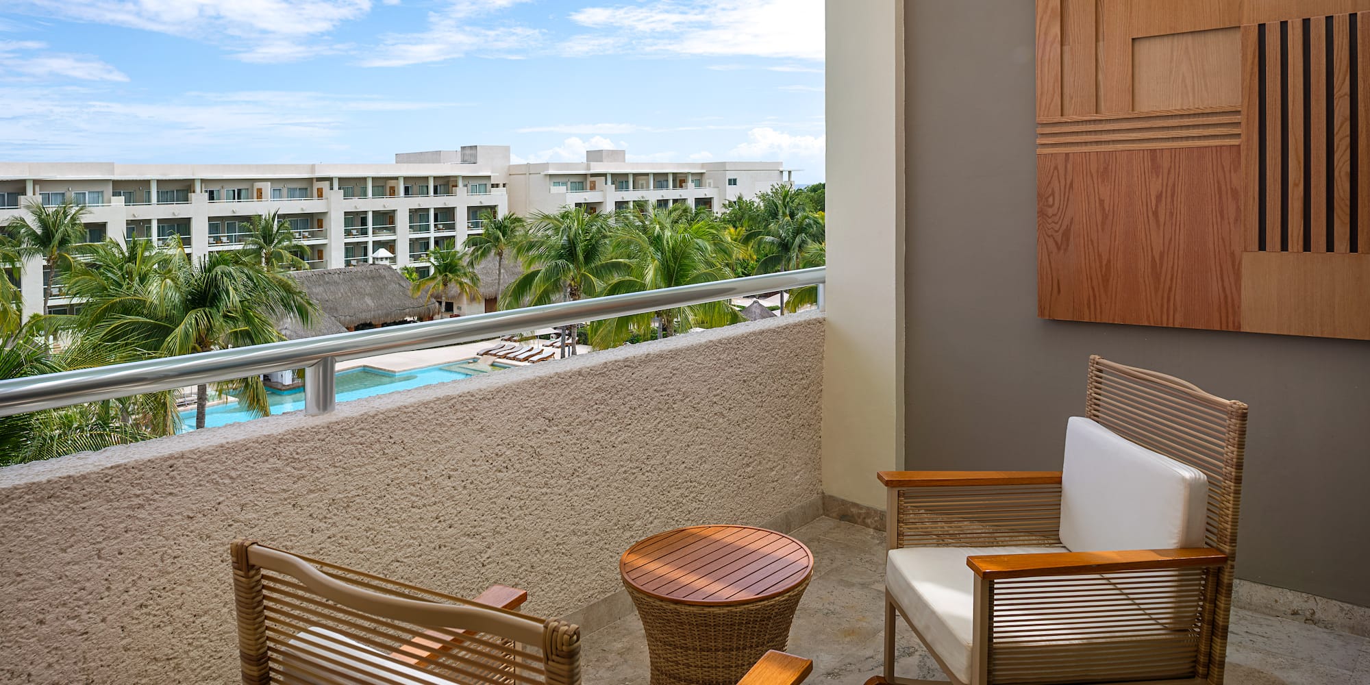 a chair and table on a balcony