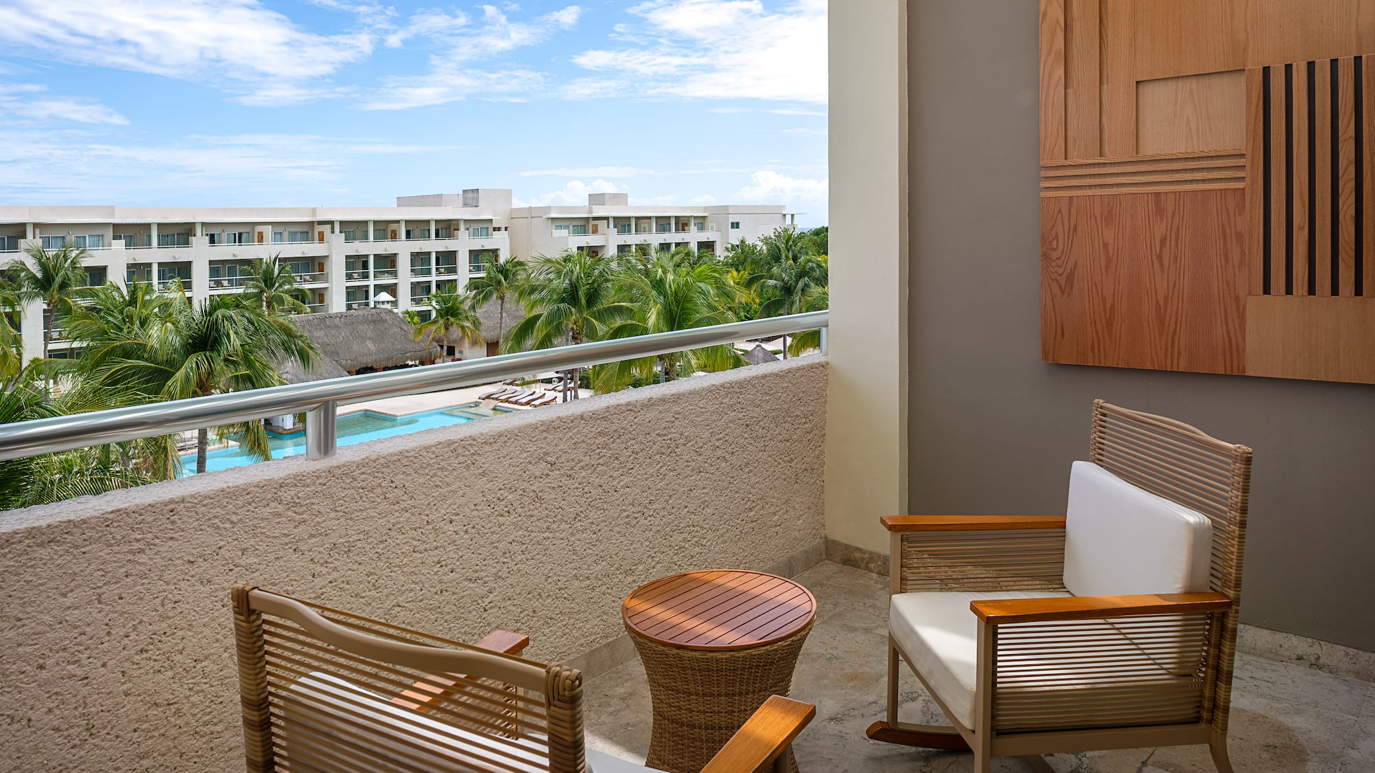 a chair and table on a balcony