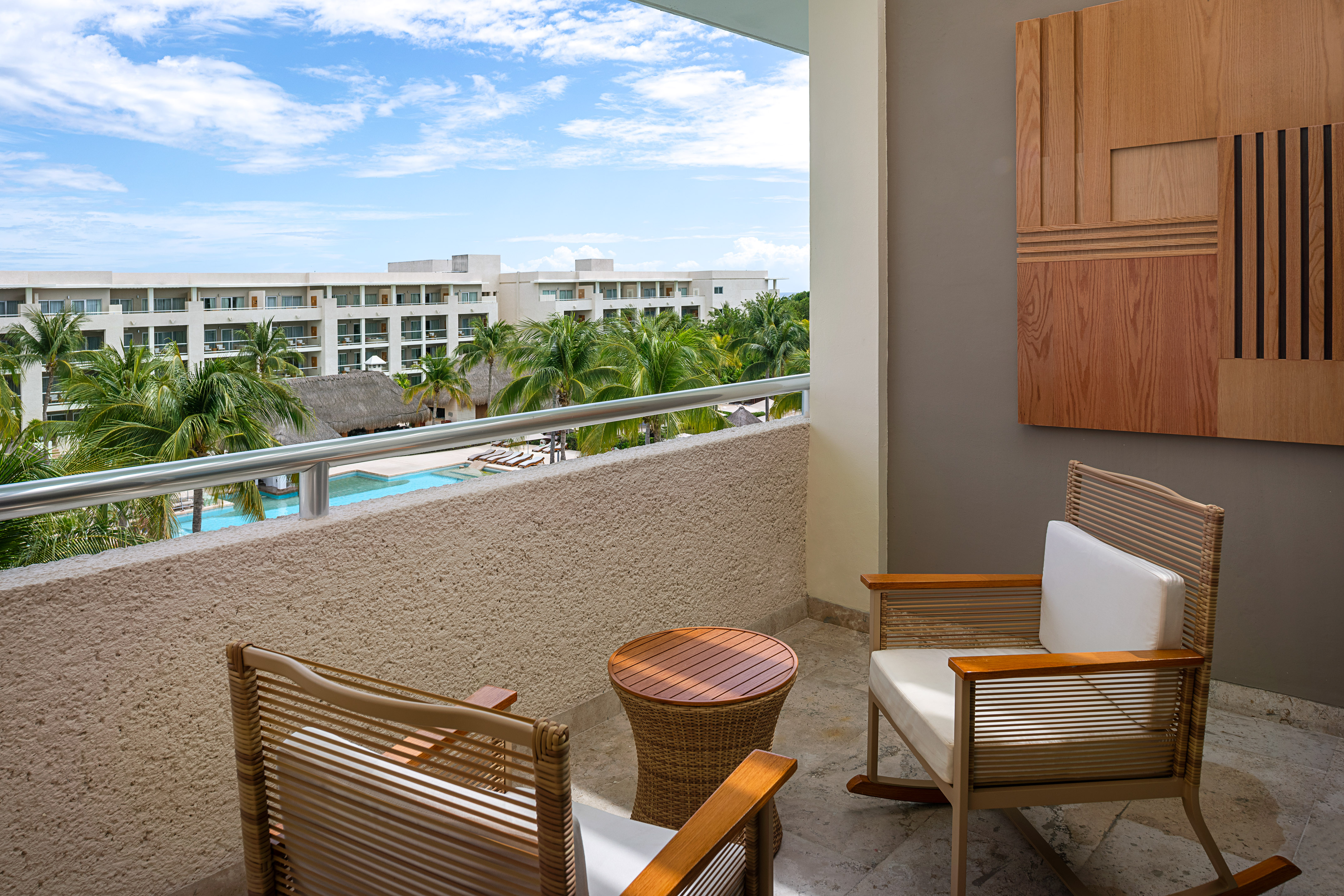 a chair and table on a balcony