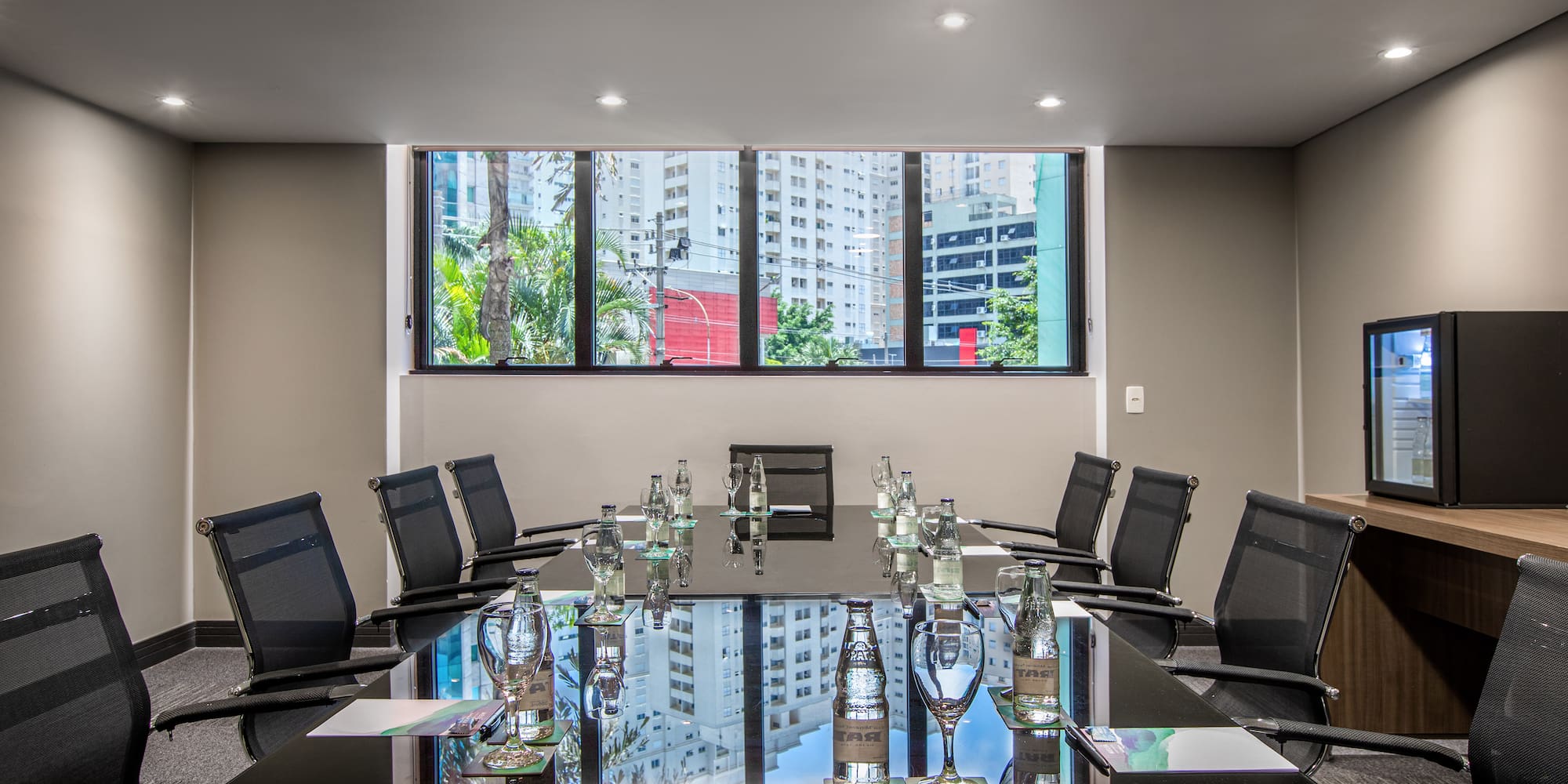 a conference room with a table and chairs