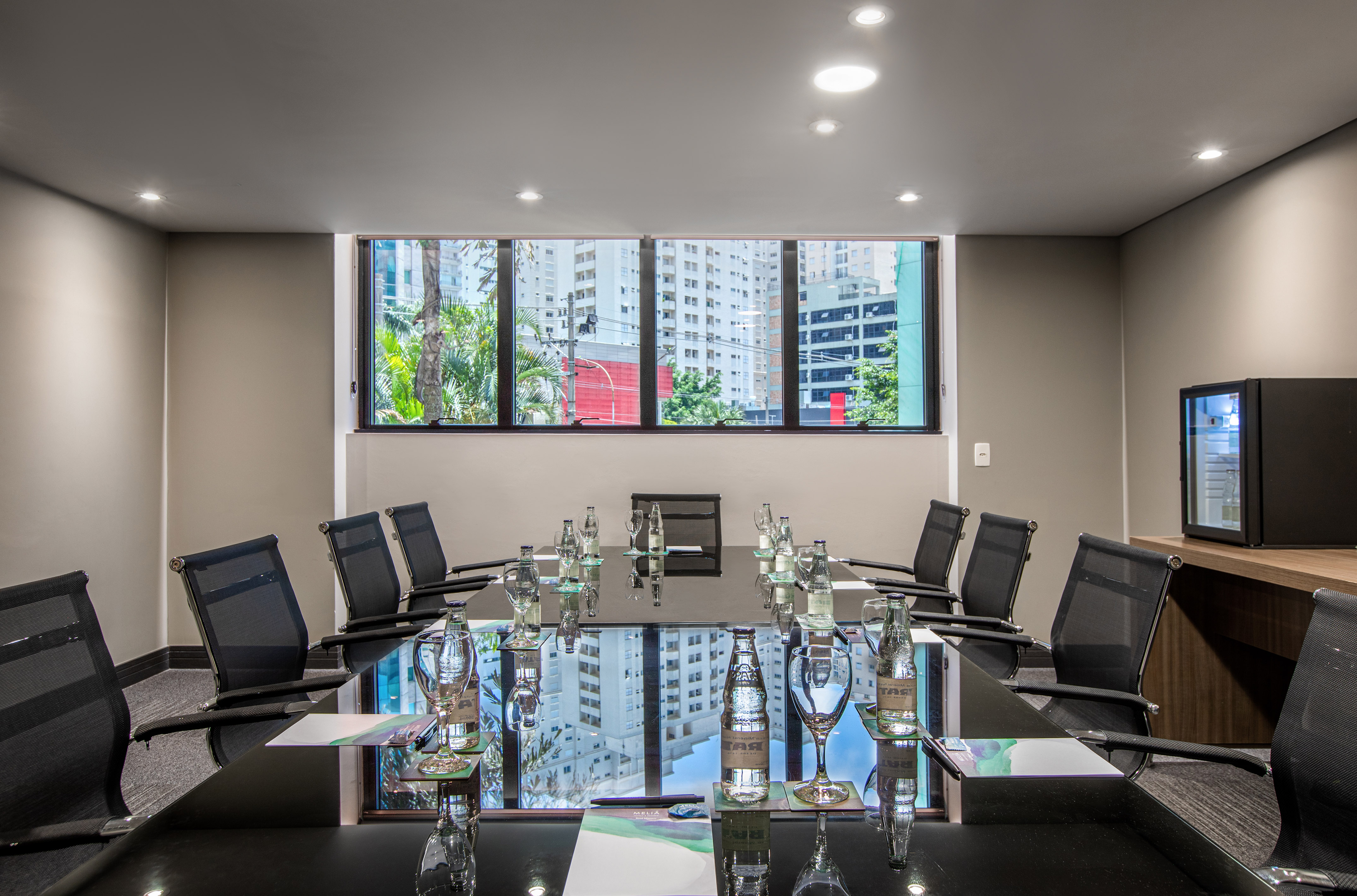 a conference room with a table and chairs