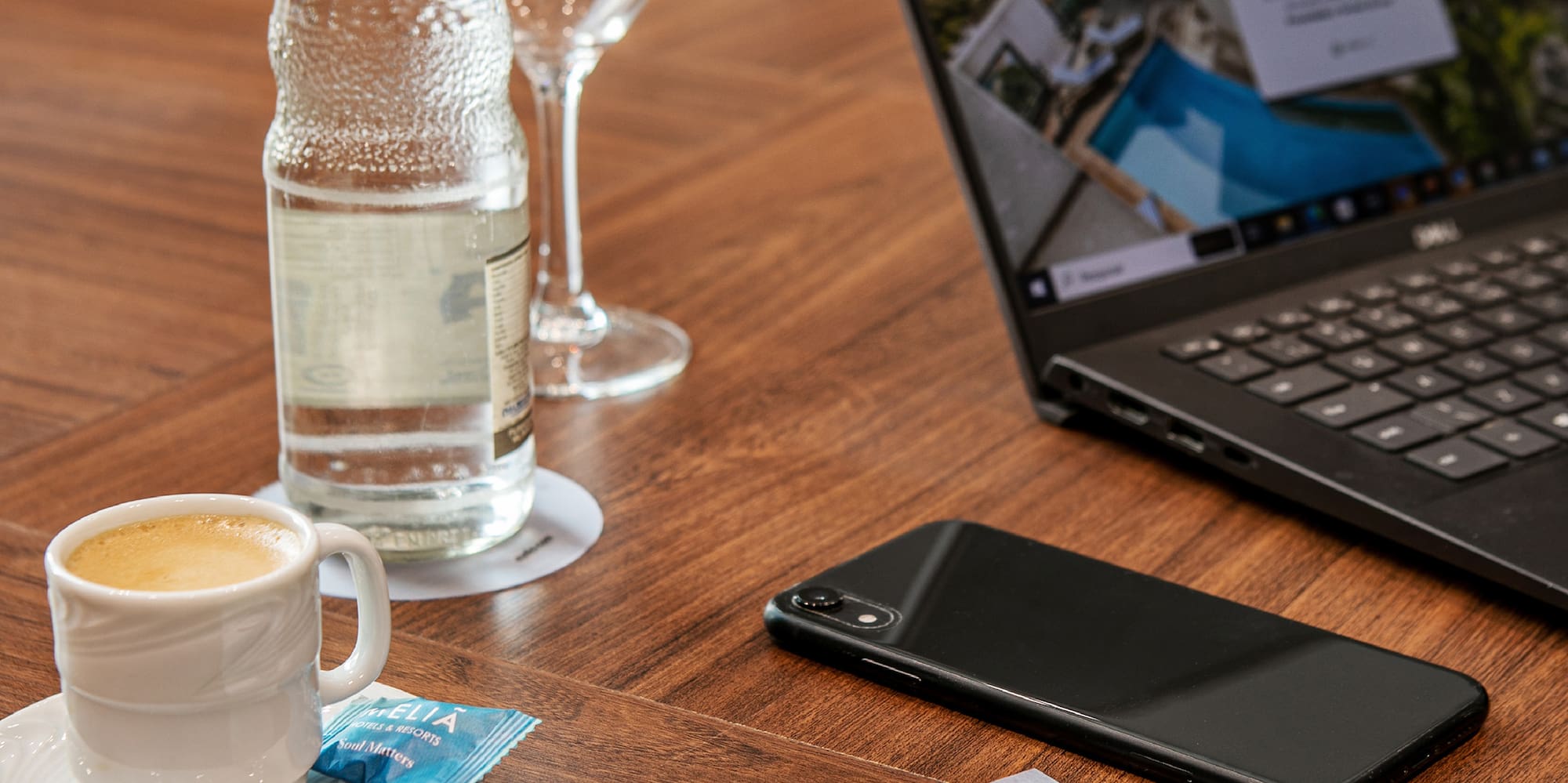 a laptop and a phone on a table
