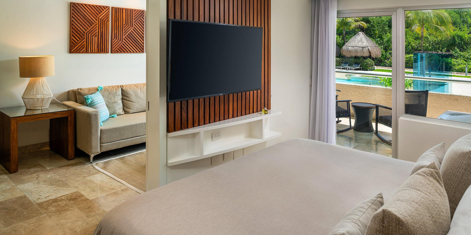 a room with a television and a pool