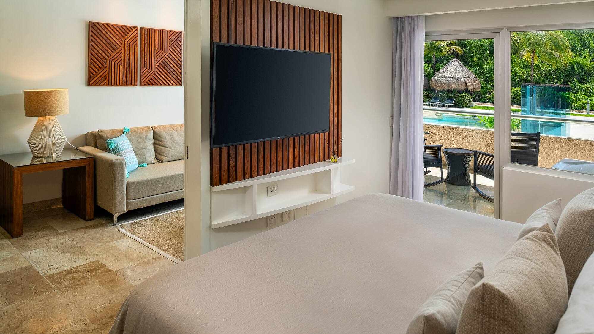 a room with a television and a pool