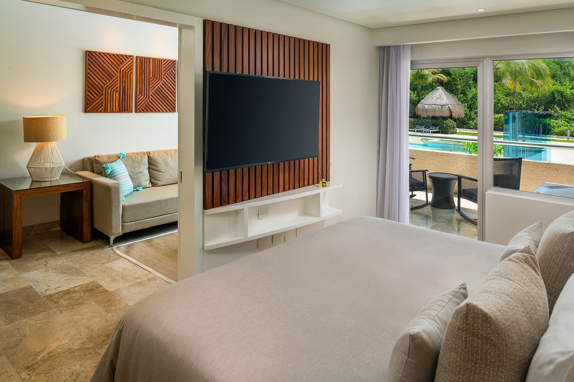 a room with a television and a pool