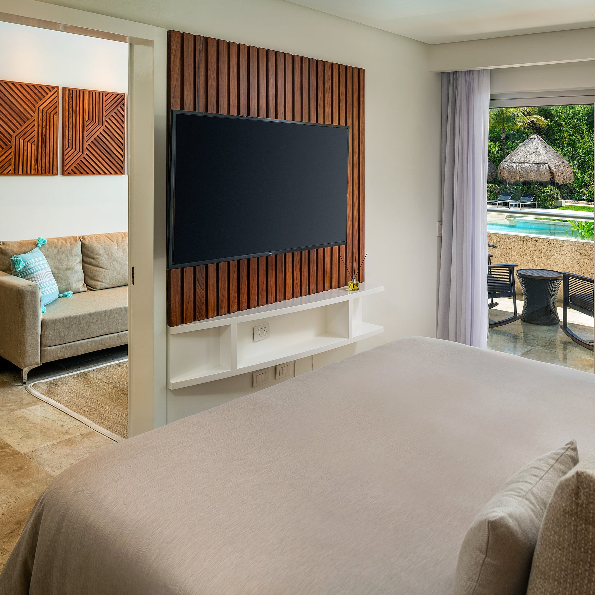 a room with a television and a pool