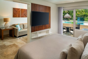 a room with a television and a pool