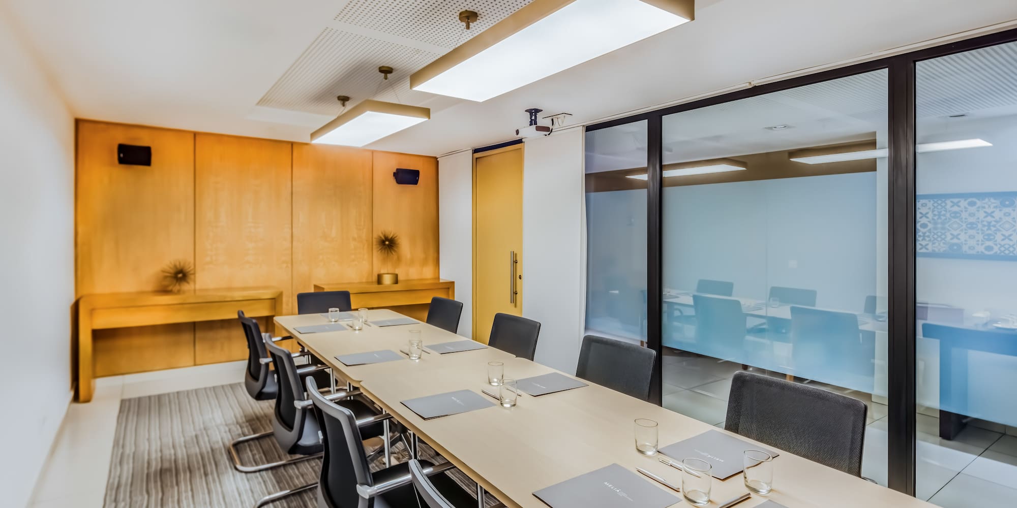 a conference room with a table and chairs