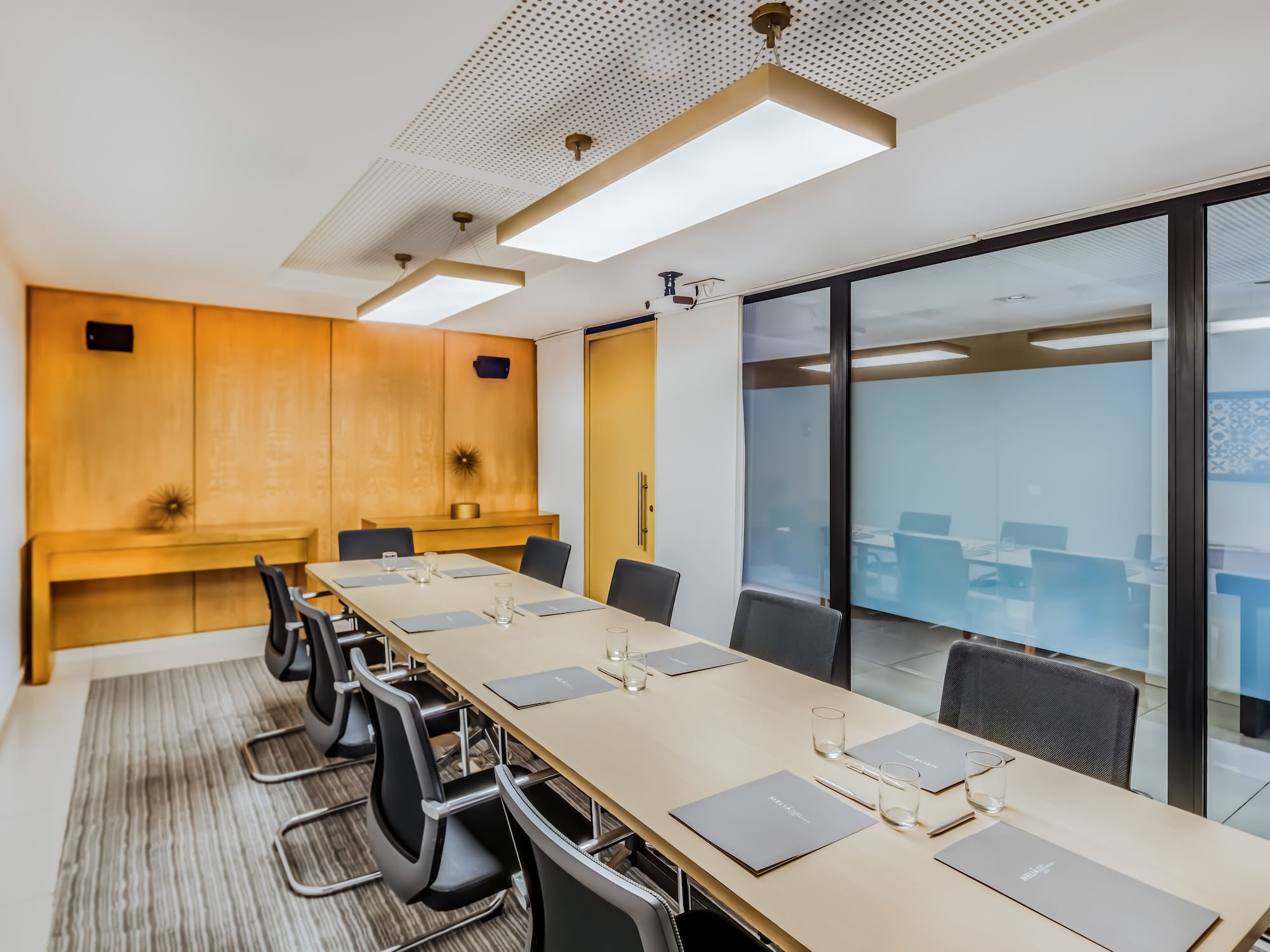 a conference room with a table and chairs