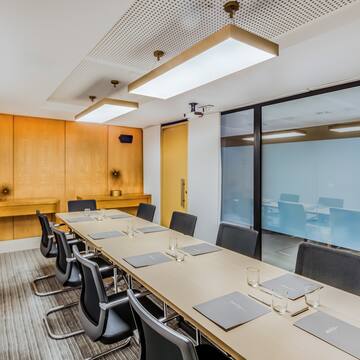 a conference room with a table and chairs
